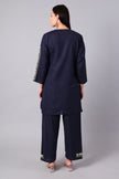 Woman wearing a navy blue traditional Cotton Summer Cord set with Aari embroidery- back