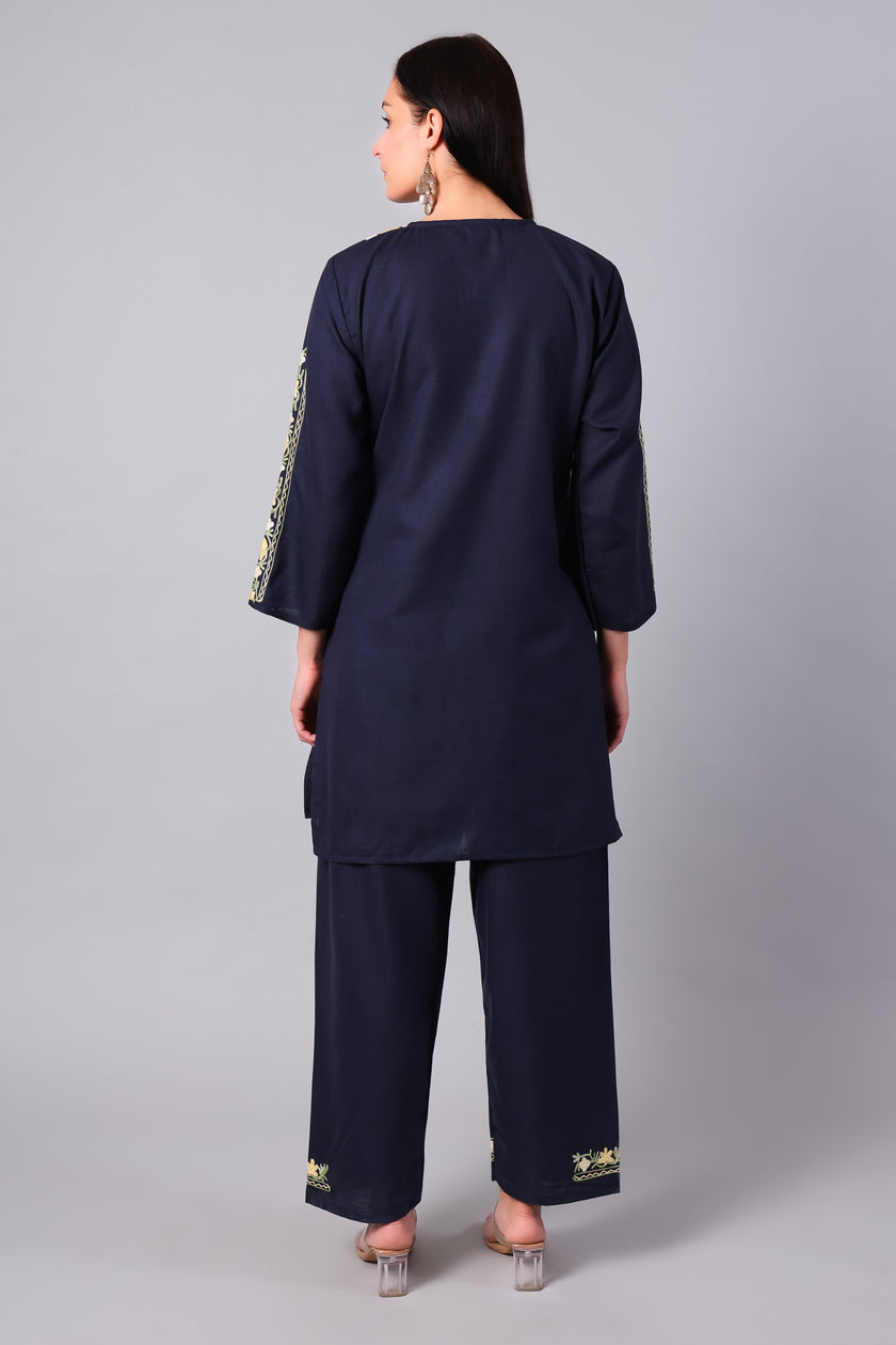 Woman wearing a navy blue traditional Cotton Summer Cord set with Aari embroidery- back
