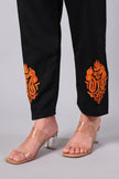 Detailed view of burnt orange Aari embroidery on black co-ord set pants