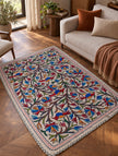 Bagh-e-Nigar Kashmiri Namda rug with colourful floral, vine and bird embroidery on ivory wool base
