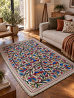 Bagh-e-Nigar Kashmiri Namda rug with colourful floral, vine and bird embroidery on ivory wool base-Lifestyle 
