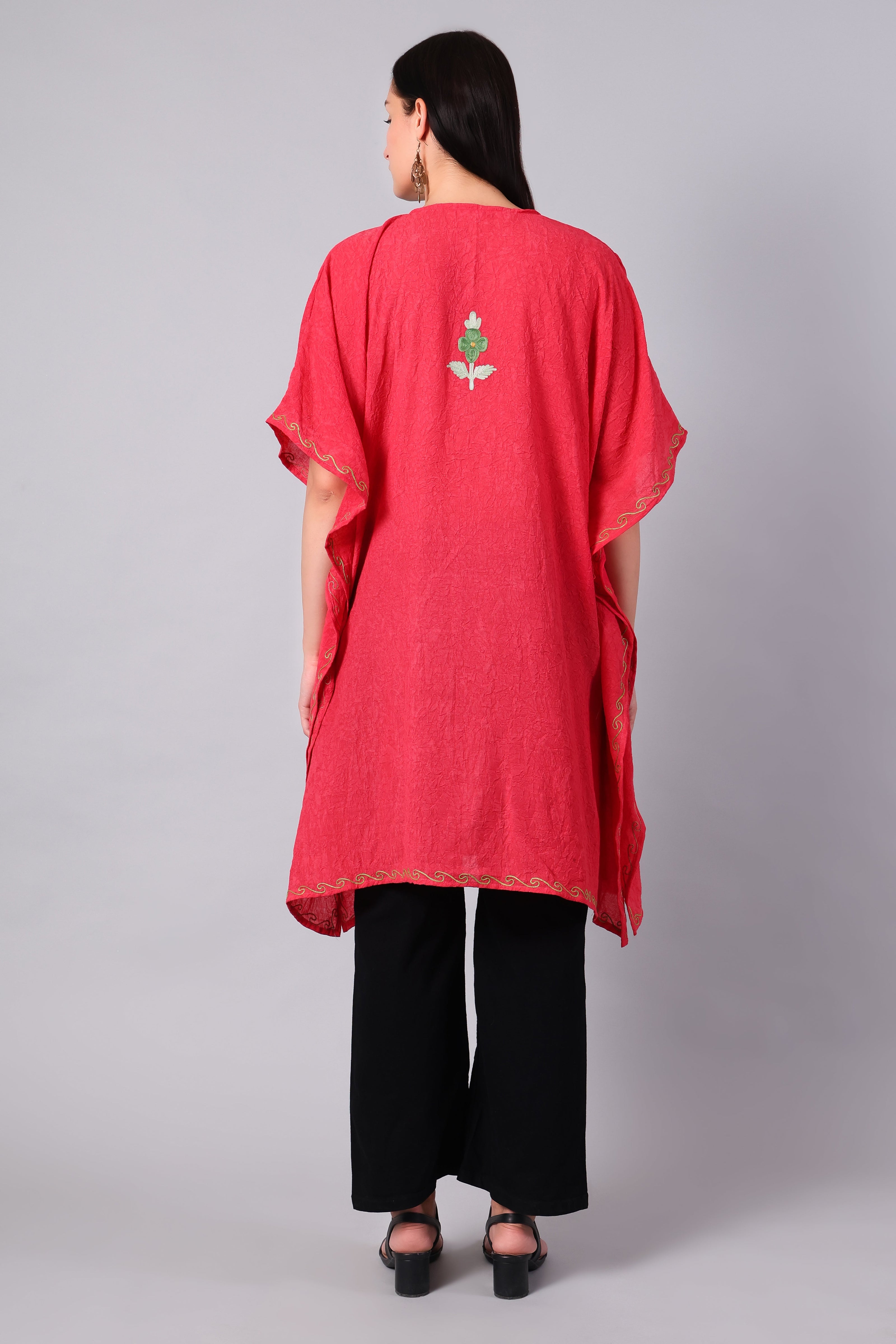 Back view of coral red Kashmiri kaftan with minimal embroidery detail