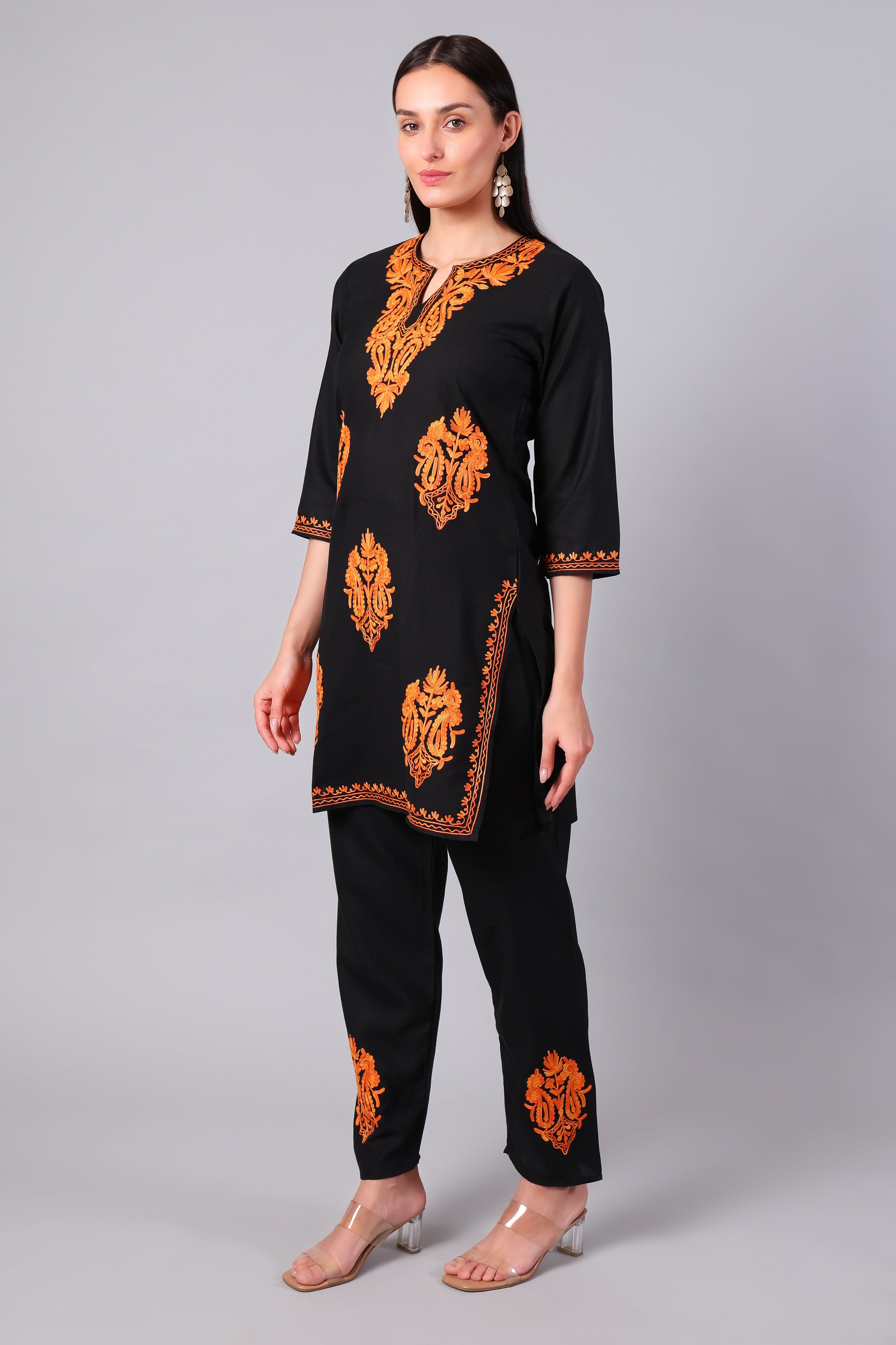 Side view of black co-ord set with straight-cut tunic and side slits