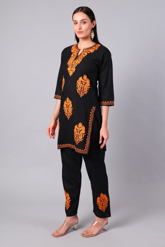 Side view of black co-ord set with straight-cut tunic and side slits