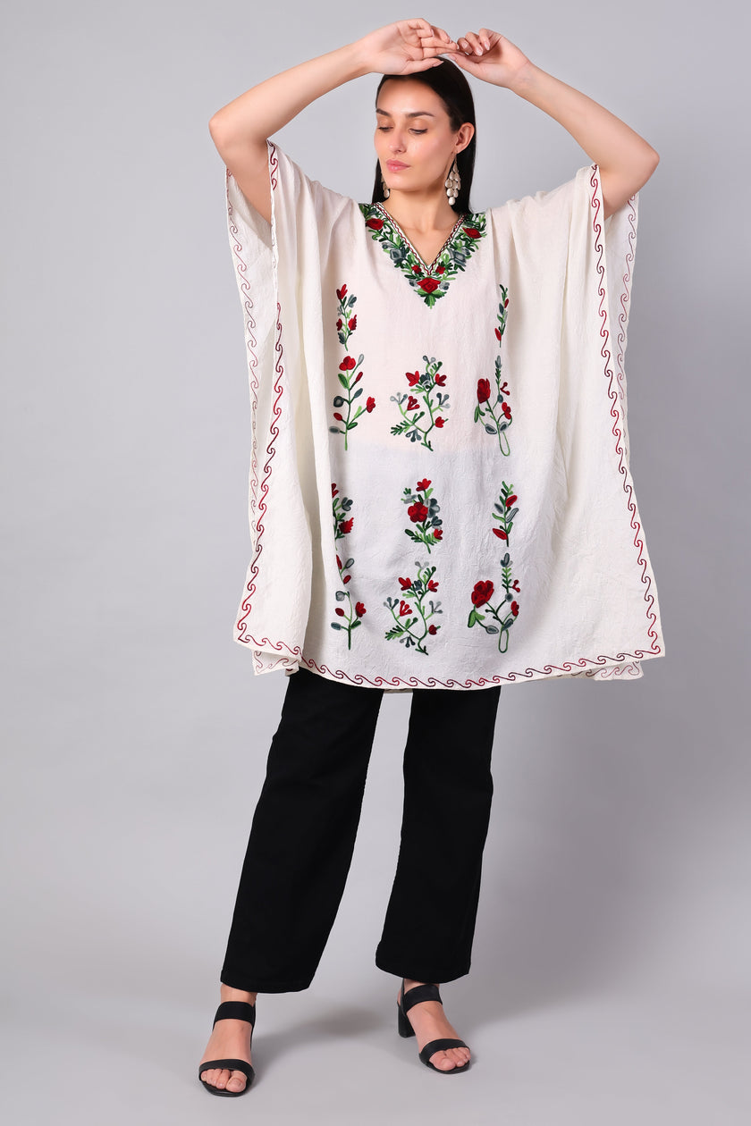 Novbahar white Kashmiri kaftan — front angle with red and green embroidery detail